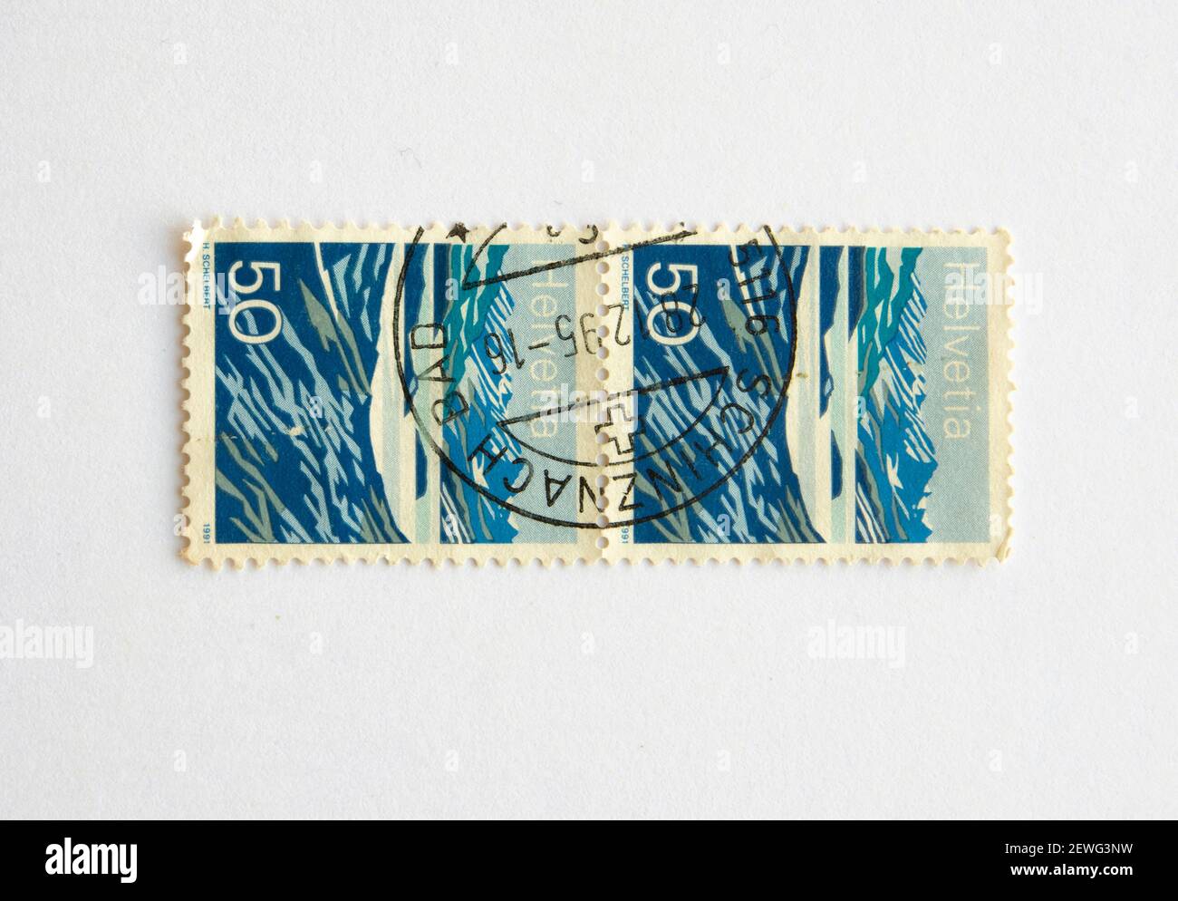 03.03.2021 İstanbul Turkey. Postage Stamp. Helvetia SWITZERLAND-CIRCA 1991: A stamp printed in Switzerland, shows a mountain lake (Lago Moesola), Stock Photo