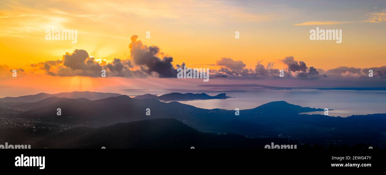 The island of Ibiza at sunrise seen from the highest point, the S'Atalanya mountain in the municipality of San Jose. The views belong to the southern Stock Photo