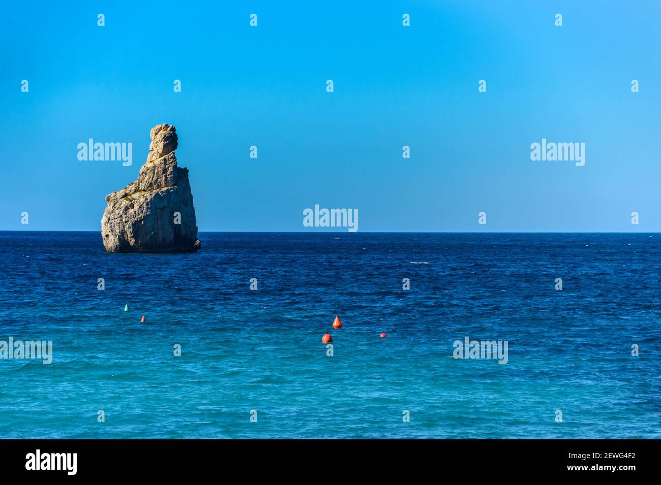 Benirras beach, Ibiza, Spain - January 31, 2020: 'Es Cap Bernat' is the name of this rock in front of Benirras beach on the north coast of Ibiza. One Stock Photo