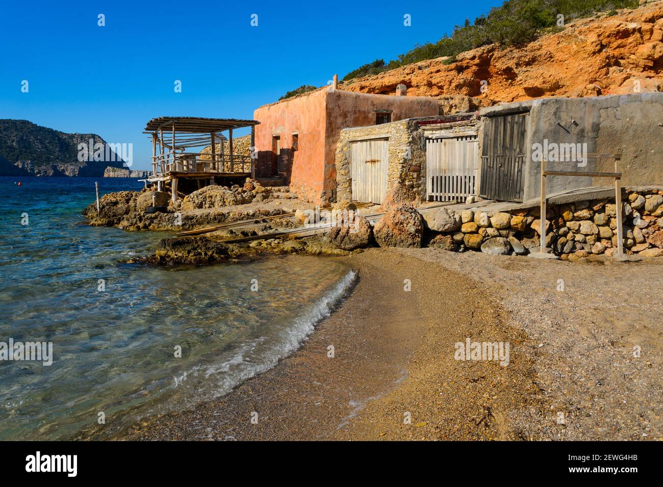 Benirras beach, Ibiza, Spain - January 31, 2020: Fisherman's house on the beach of Benirras, northern part of the island of Ibiza. These houses shelte Stock Photo