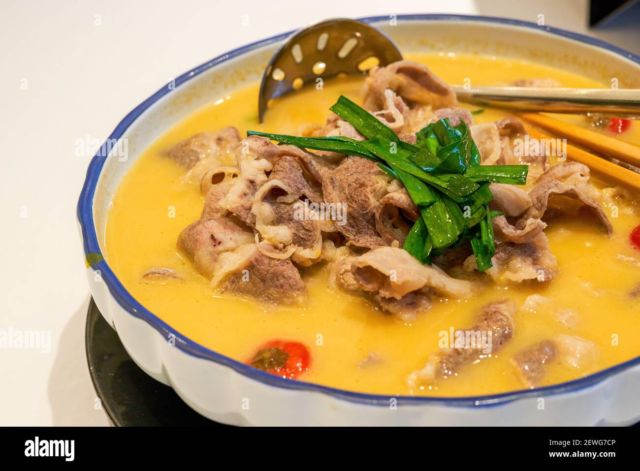 A delicious Chinese Cantonese dish with beef in golden soup Stock Photo