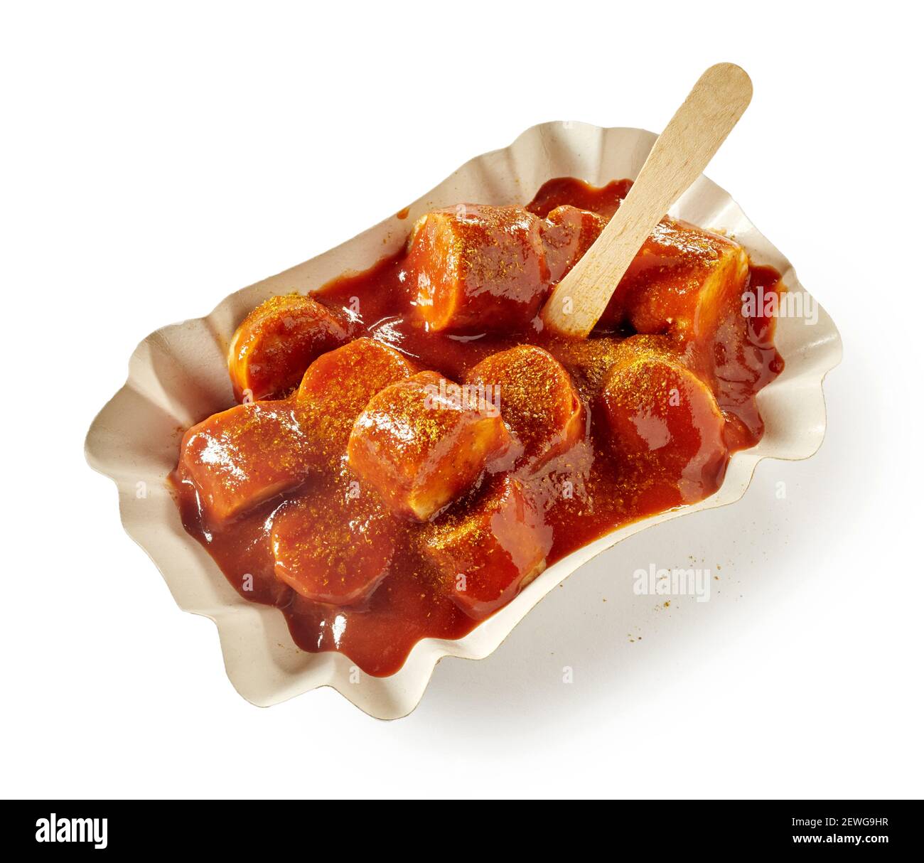From above of yummy currywurst with pork sausage chunks and tomato ...