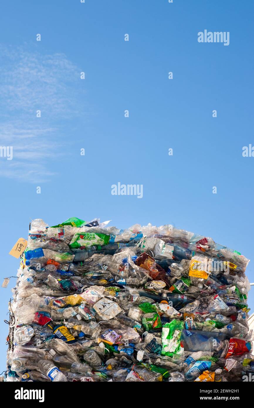 Commercial waste management, bales of recycling materials, plastics stacked up. Stock Photo