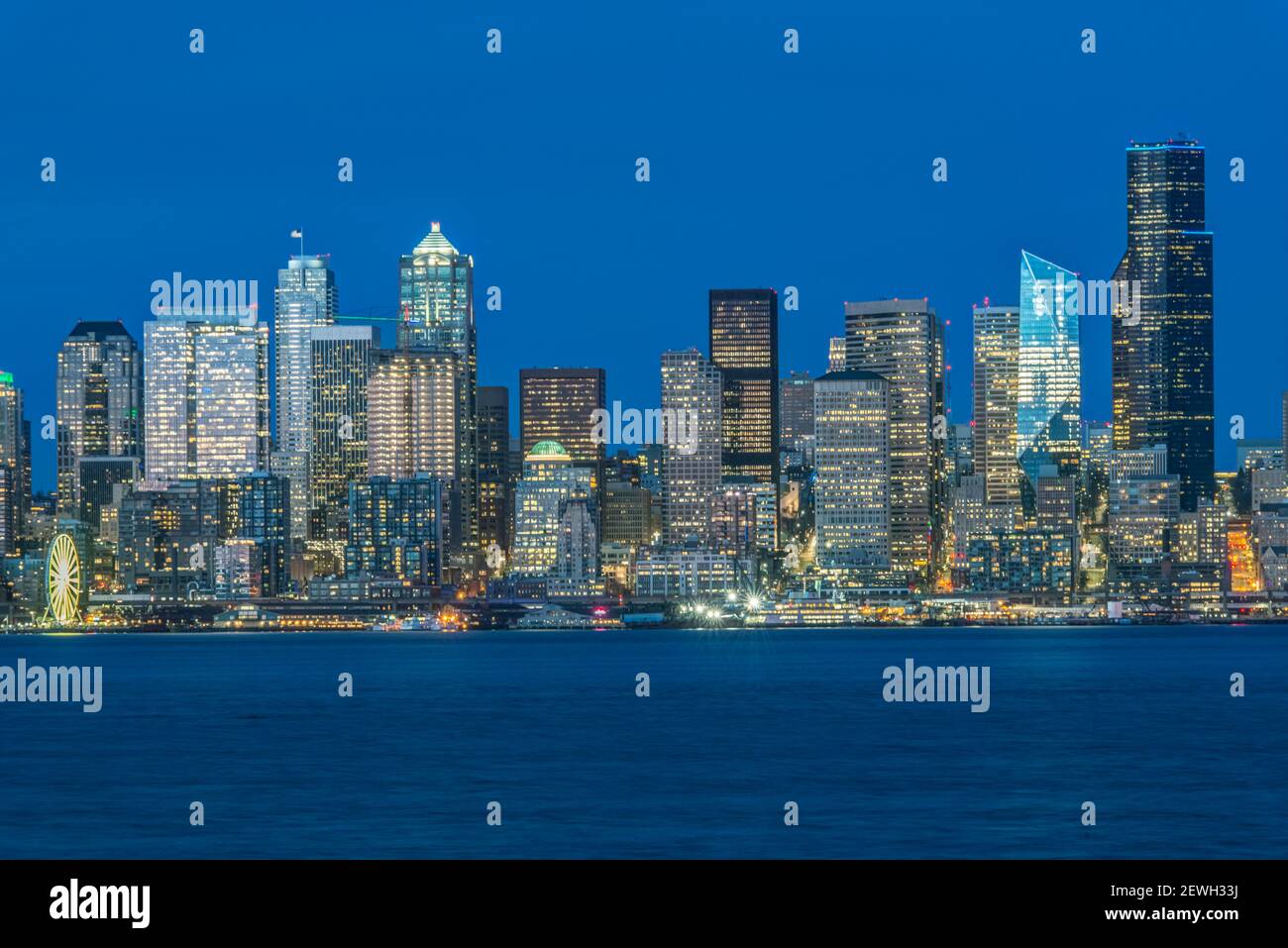 Seattle skyline, from Puget Sound, downtown buildings at night Stock