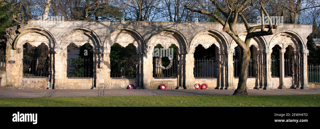 YORK, NORTH YORKSHIRE, UK - MARCH 14, 2010: Panorama view of stone arches in Deans Park which hold a war memorial plaque to the 2nd British Division Stock Photo