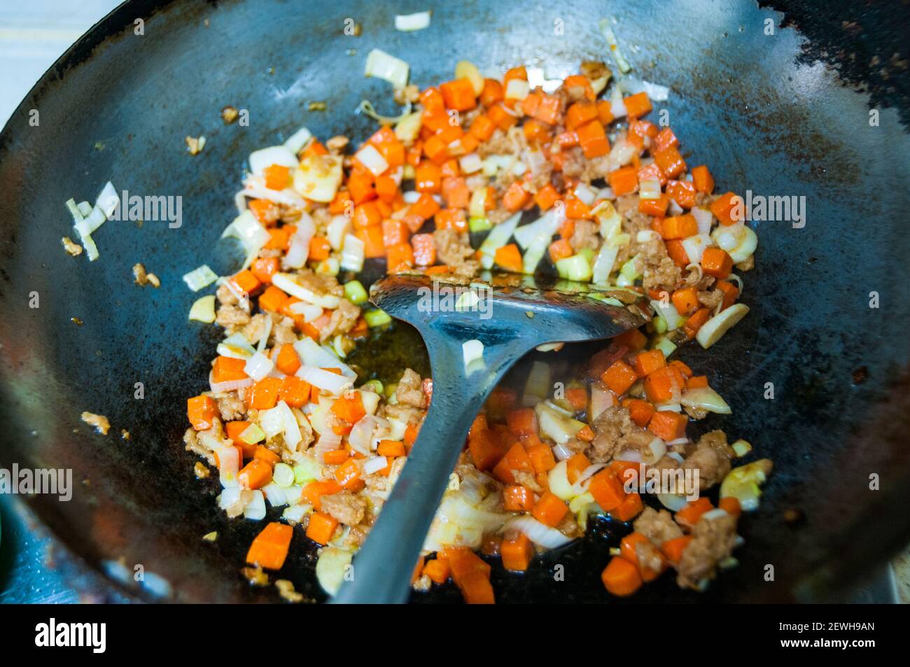 Cooking kimchi fried rice using Omipork a plant-based meat substitute in its ‘minced pork’ form. Stock Photo