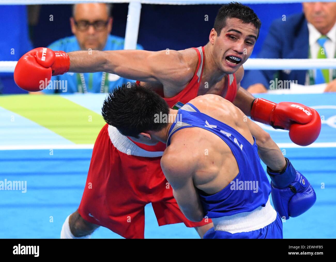 Shakhram Giyasov (UZB), red and Daniyar Yeleussinov (KAZ), blue, compete in  a men's welterweight boxing match finals at Riocentro - Pavilion 6 during  the Rio 2016 Summer Olympic Games. Mandatory Credit: Robert