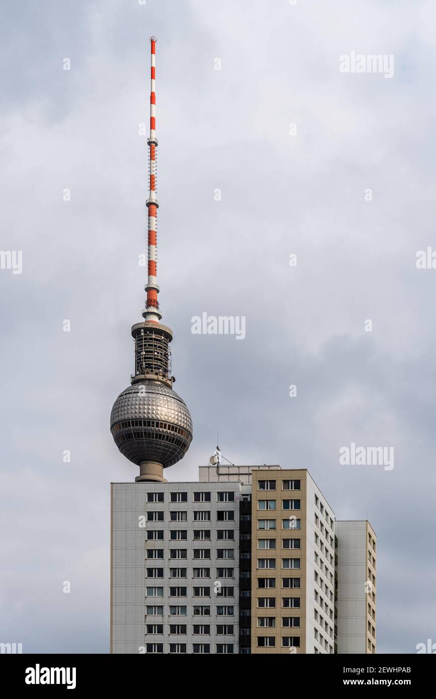 Cityscape of Berlin with skyscraper and TV tower against blue sky with clouds. Stock Photo
