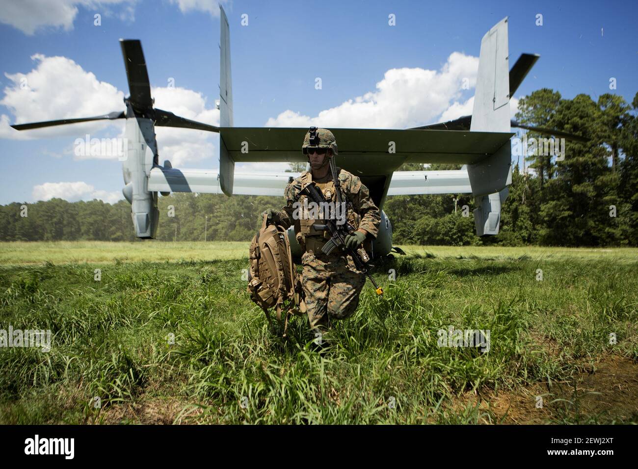 A Marine exits a MV-22 Osprey during a vertical assault raid at Camp Lejeune, N.C., Aug. 23, 2016. The raid was part of their pre deployment training in preparation for the 24th Marine Expeditionary Unit’s upcoming deployment. The Marine is with Lima Company, Battalion Landing Team, 3rd Battalion, 6th Marine Regiment. (Photo by Lance Cpl. Melanye E. Martinez/U.S. Marine Corps)    Please note: Fees charged by the agency are for the agency’s services only, and do not, nor are they intended to, convey to the user any ownership of Copyright or License in the material. The agency does not claim any Stock Photo