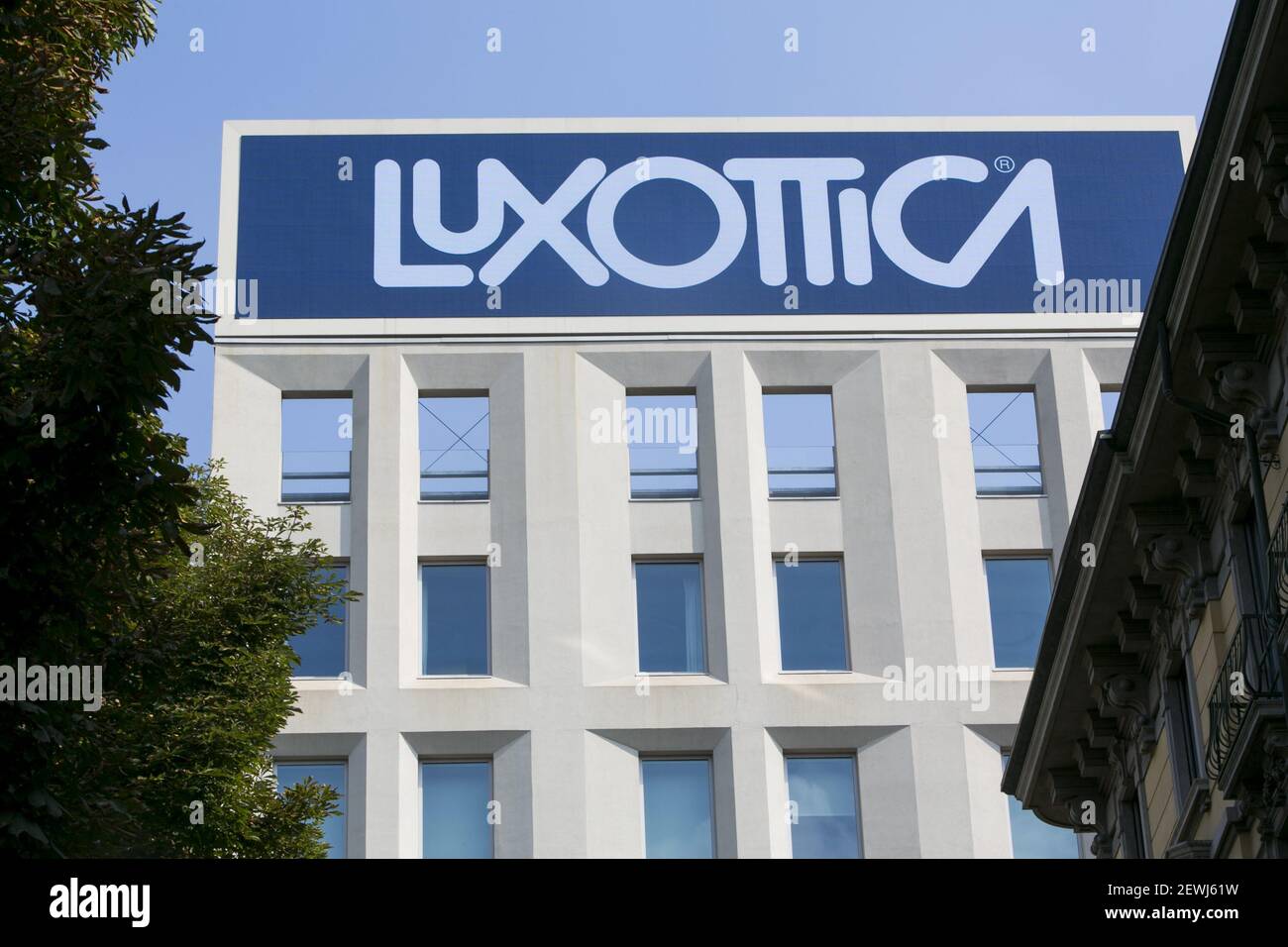 A logo sign outside of the headquarters of the Luxottica Group S.p.A. in Milan, Italy on