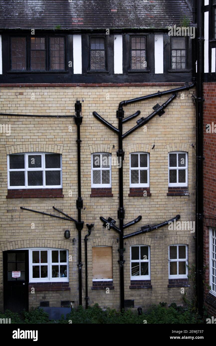 Road network of gutters on a typical English house wall. Stock Photo