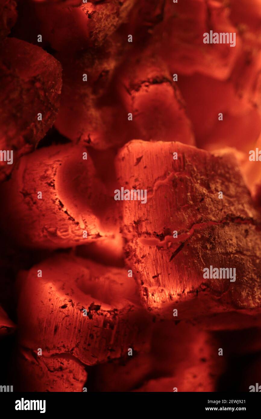 Close-up of red hot glowing firewood in a campfire Stock Photo