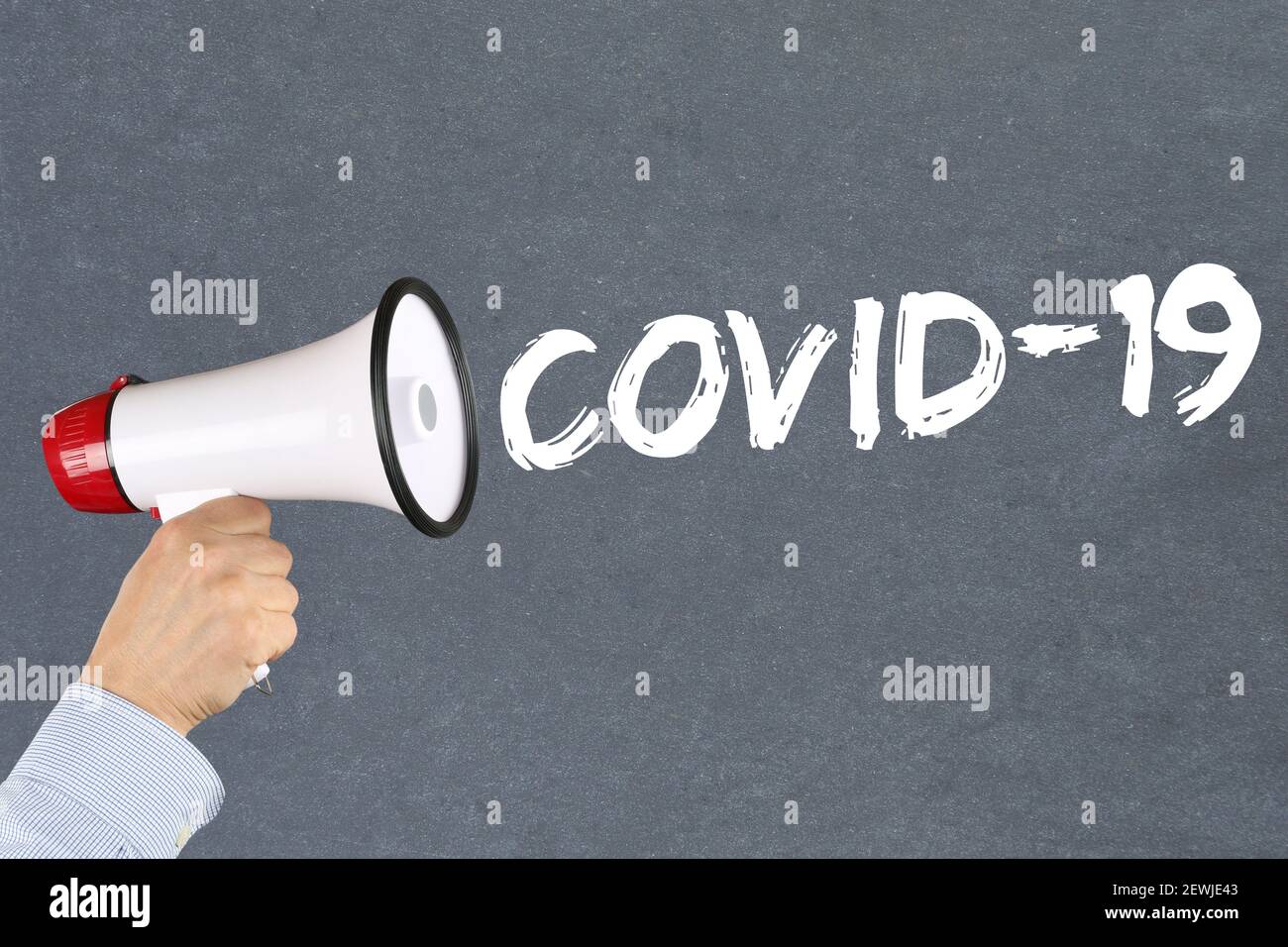 COVID-19 COVID Coronavirus corona virus disease ill illness hand with megaphone. Stock Photo