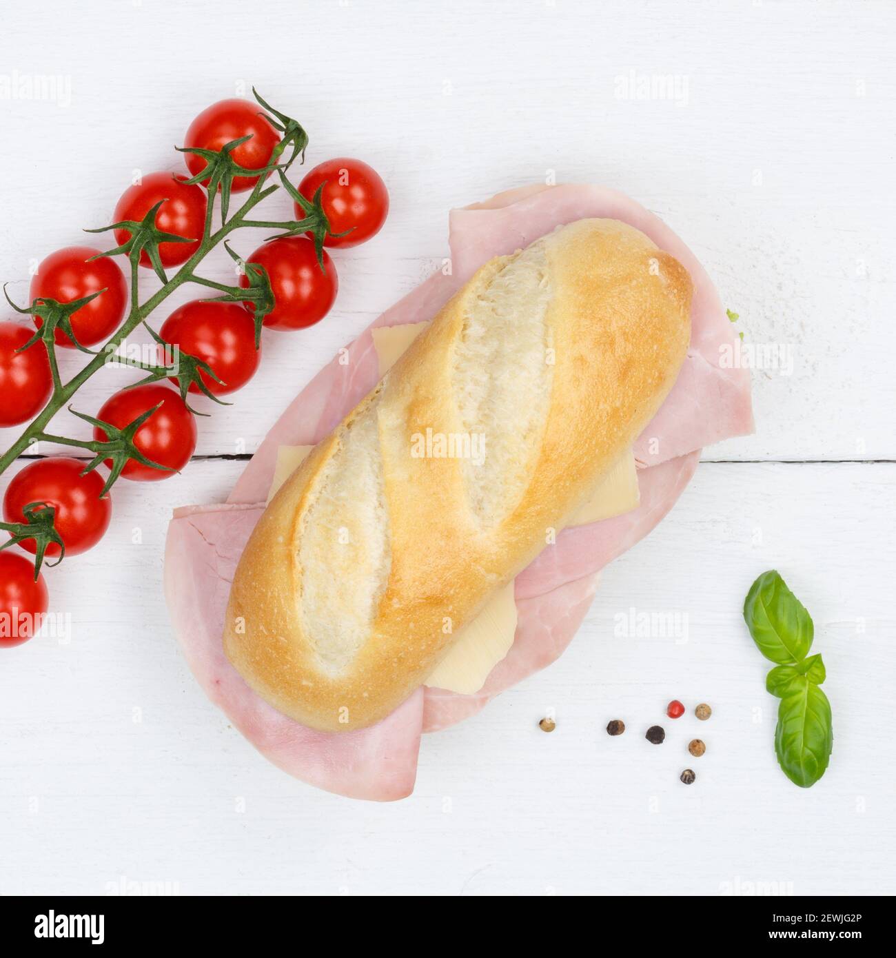 Sub sandwich with ham and cheese square from above on wooden board wood. Stock Photo