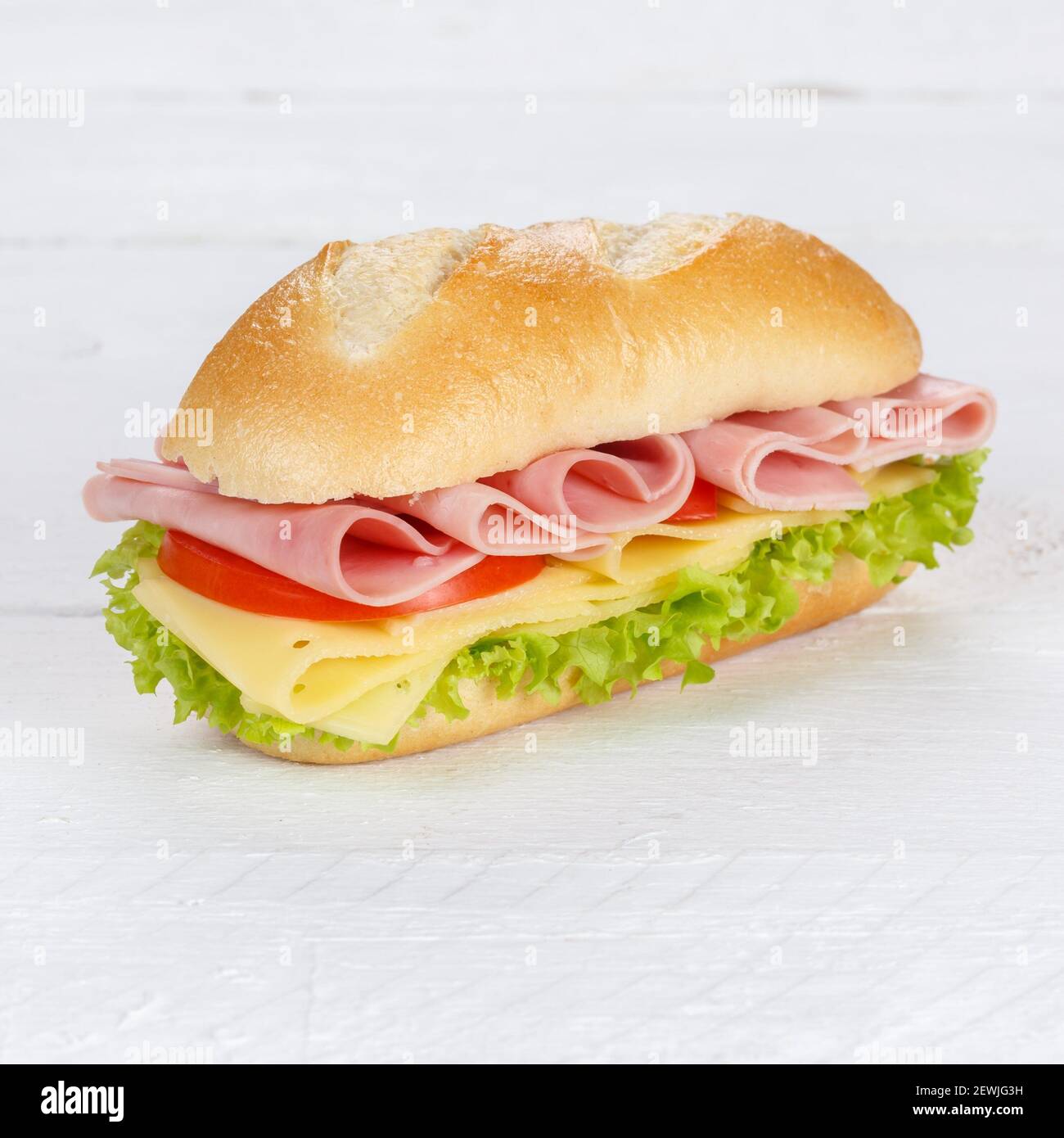 Sandwich with ham and cheese fresh square on wooden board wood. Stock Photo