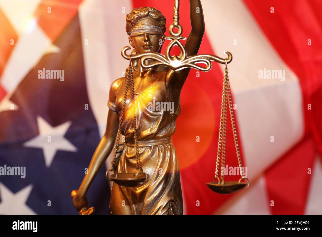 Symbol image: Justitia in front of a USA flag. Stock Photo