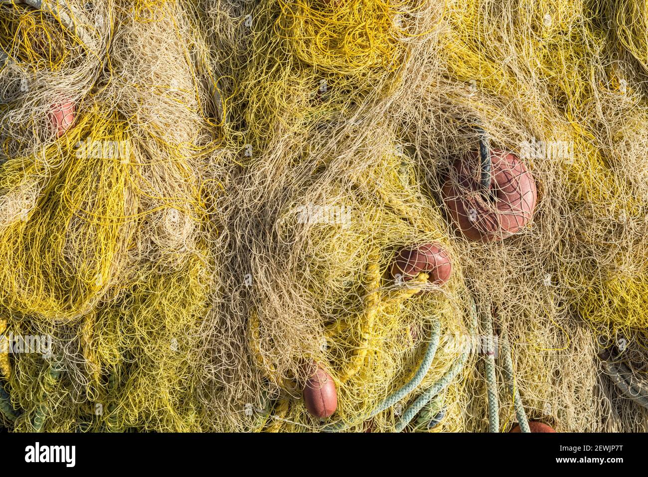 Pile of commercial fishing net with cords and floats Stock Photo