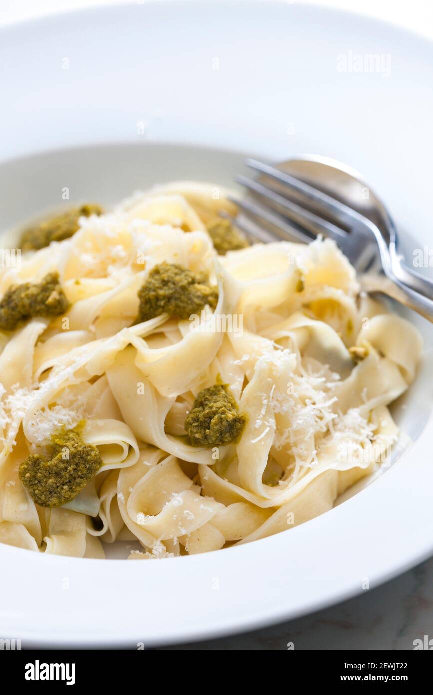 pasta tagliatelle with green pesto Stock Photo Alamy