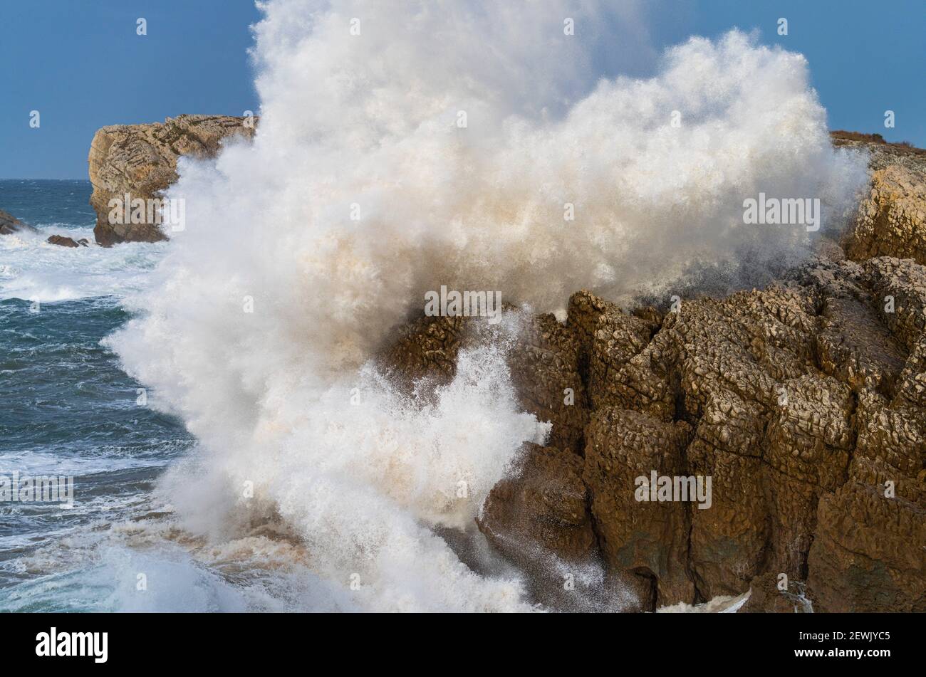 Swell and storm in the Hermitage of the Virgen del Mar in San Roman de la Llanilla in the Municipality of Santander. Virgen del Mar Island in the Stock Photo