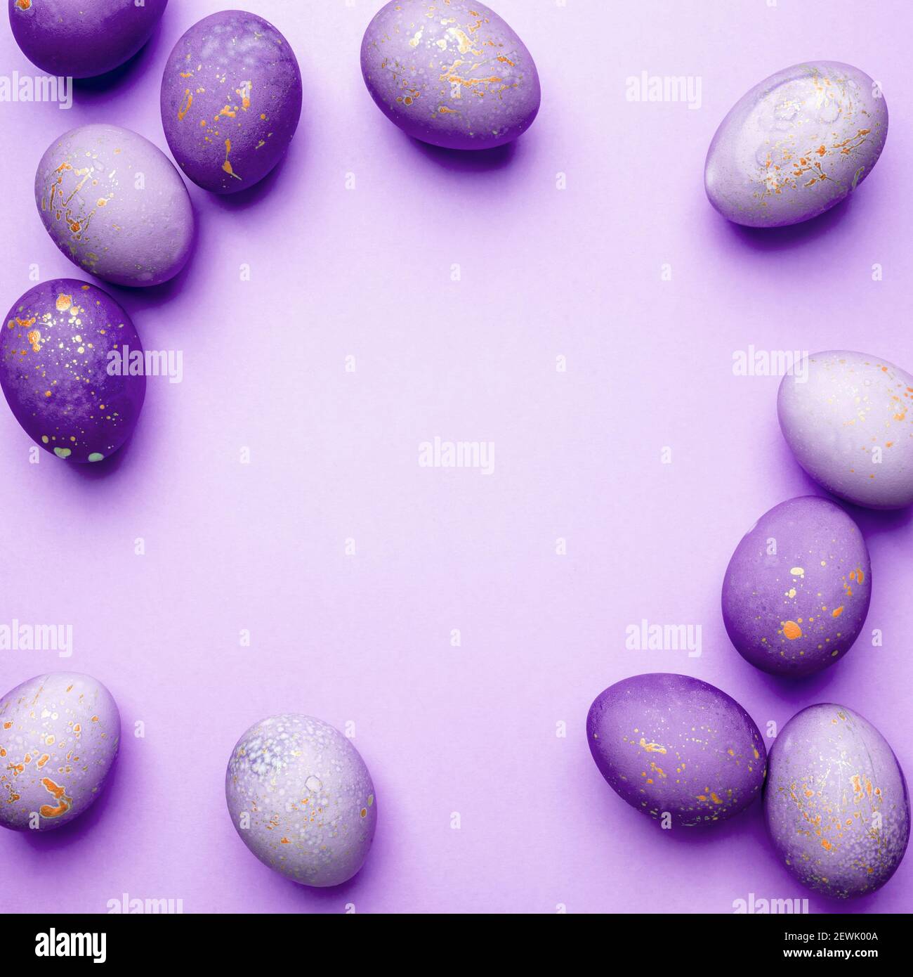 Easter frame of eggs painted in purple color Stock Photo - Alamy