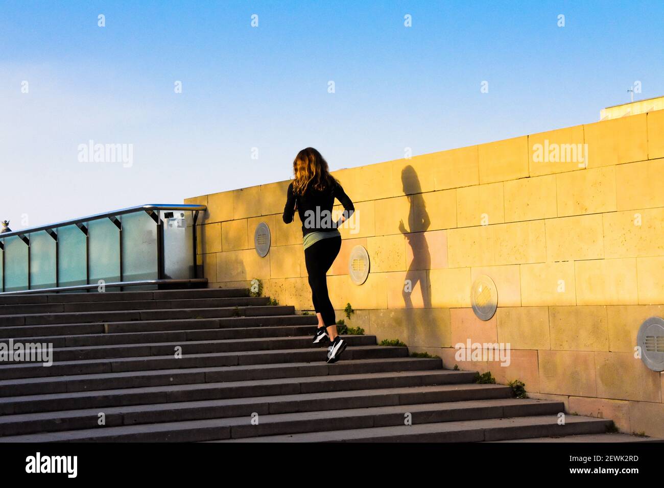 Woman Climbing Stairs High Resolution Stock Photography and Images Alamy
