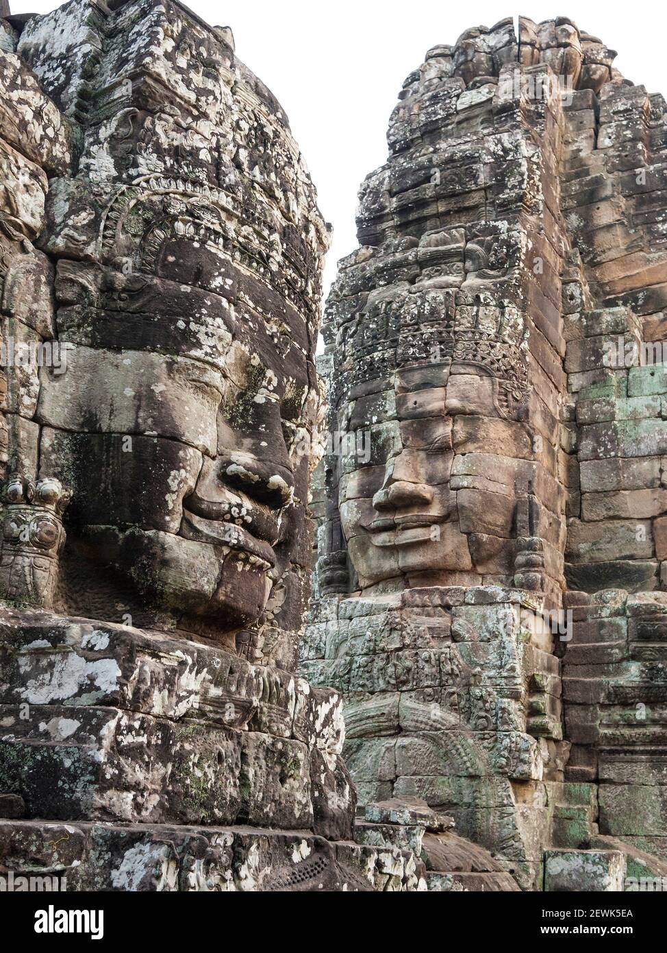 The Bayon is a well-known and richly decorated Khmer temple at Angkor in Cambodia. Built in the late 12th century or early 13th century as the Stock Photo