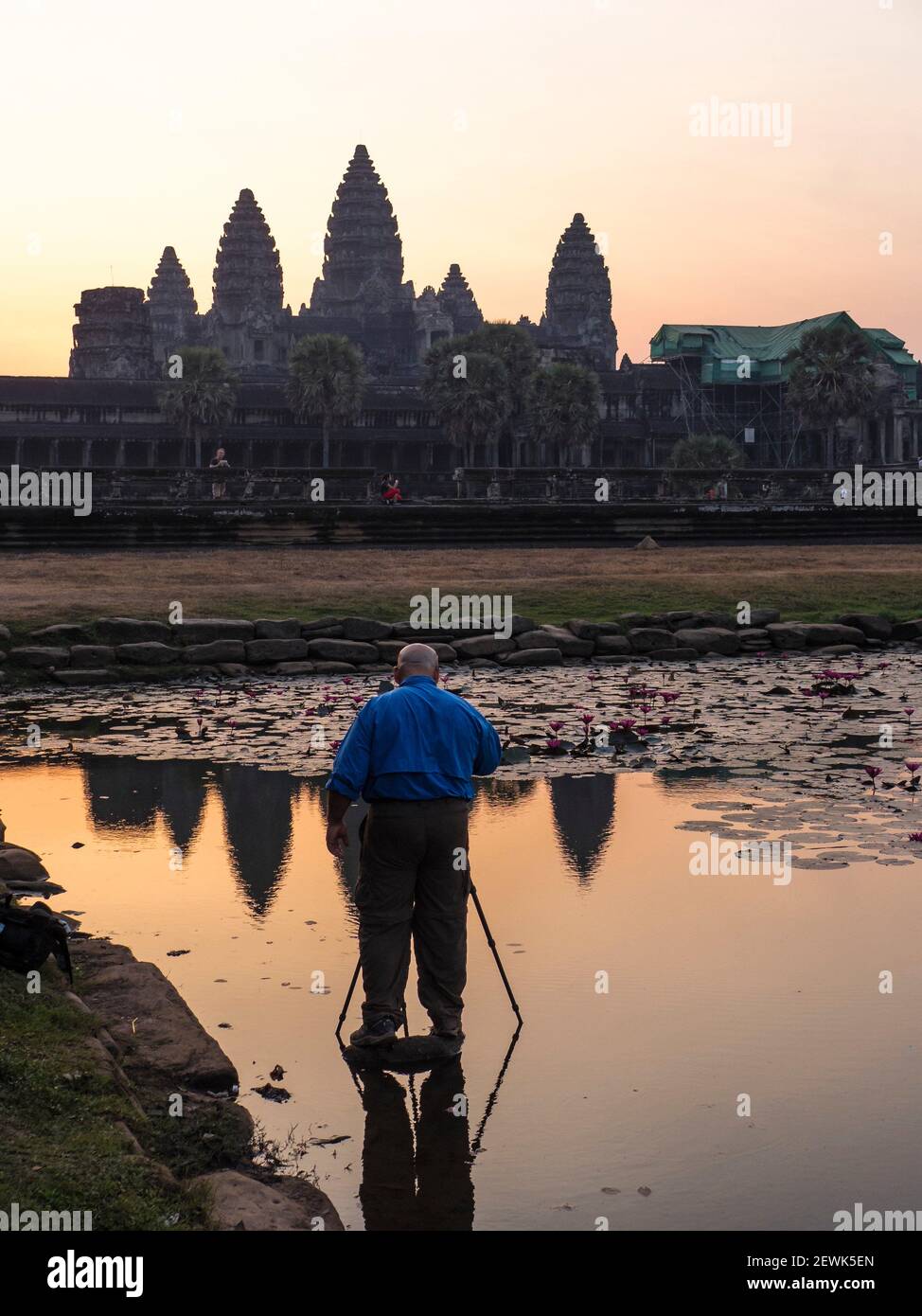 Angkor Wat is the largest Hindu temple complex and the largest religious monument in the world. The temple was built by a king Suryavarman II in the Stock Photo