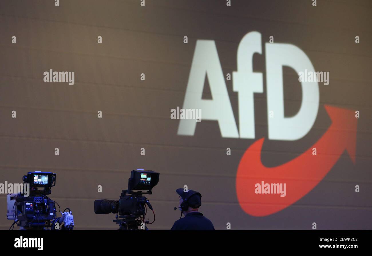 FILED - 30 June 2018, Bavaria, Augsburg: Cameras stand in front of the AfD logo at an AfD party conference. The Federal Office for the Protection of the Constitution has classified the entire AfD as a suspected right-wing extremist case. According to dpa information, the president of the authority, Thomas Haldenwang, informed the state offices for the protection of the constitution about this on Wednesday in an internal video conference. Due to ongoing court proceedings, the federal office is currently not commenting publicly on the issue of the AfD's assessment. Previously, the 'Spiegel' and Stock Photo