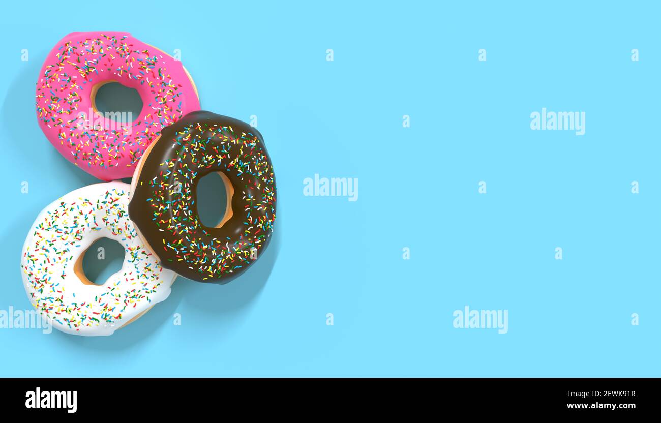 multicolored sweet donuts with sprinkles on blue background Stock Photo