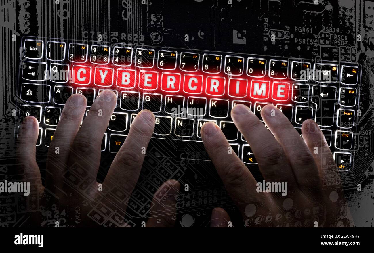 Cybercrime visualization is typed on the keyboard. Stock Photo