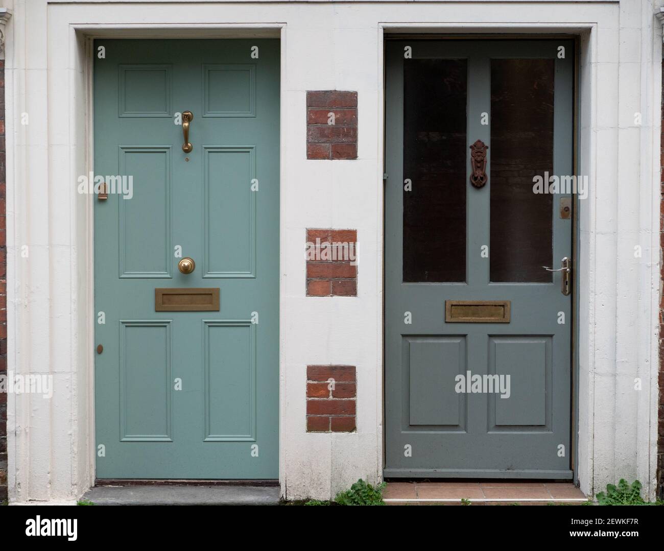 Neighbours with very different front doors and door steps in Westbury, Wiltshire, England, UK. Stock Photo
