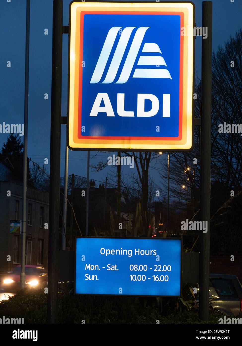 Illuminated Aldi sign in twilight at Westbury, Wiltshire, England, UK. Stock Photo