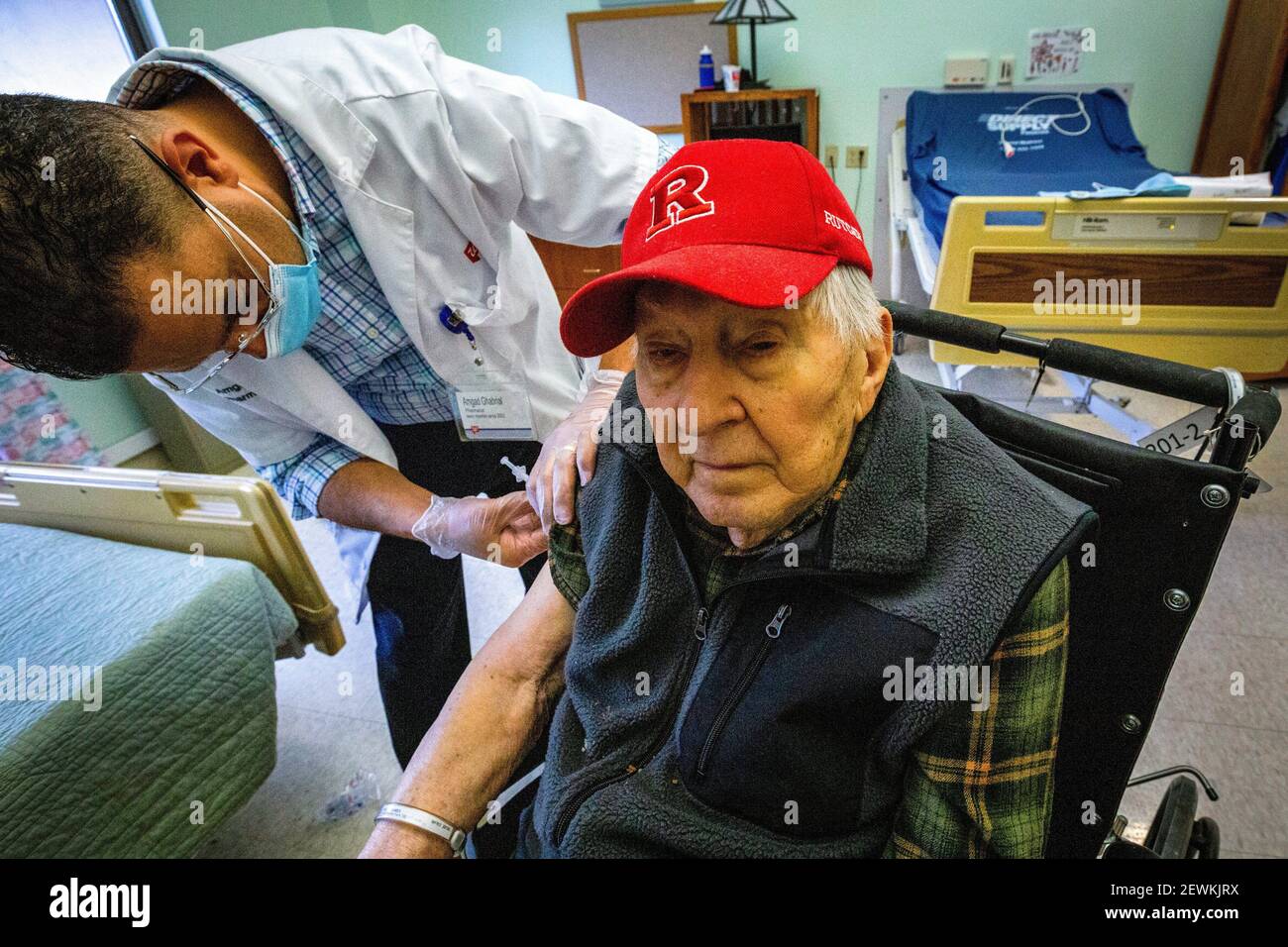 Resident James Mikusi receives the COVID-19 vaccination at the New Jersey Veterans Memorial Home at Menlo Park, Edison, N. J. , Jan. 5, 2021. These Stock Photo
