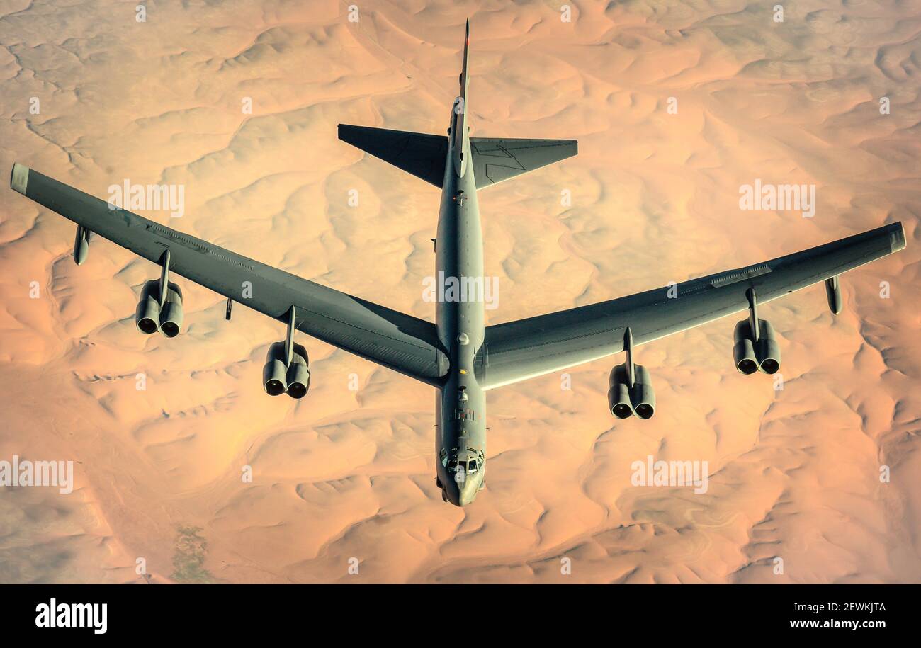 A U. S. Air Force B-52 Stratofortress assigned to the 2nd Bomb Wing departs after receiving fuel from a KC-135 Stratotanker assigned to the 340th Stock Photo