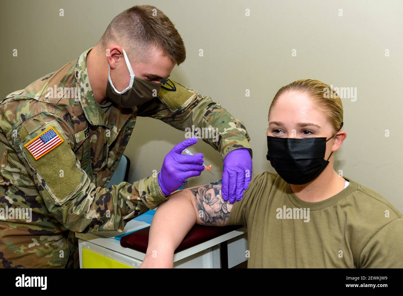 U. S. Army Spc. Virginia Monts, South Carolina National Guard 1-151st Attack Reconnaissance Battalion petroleum supply specialist, is injected with Stock Photo
