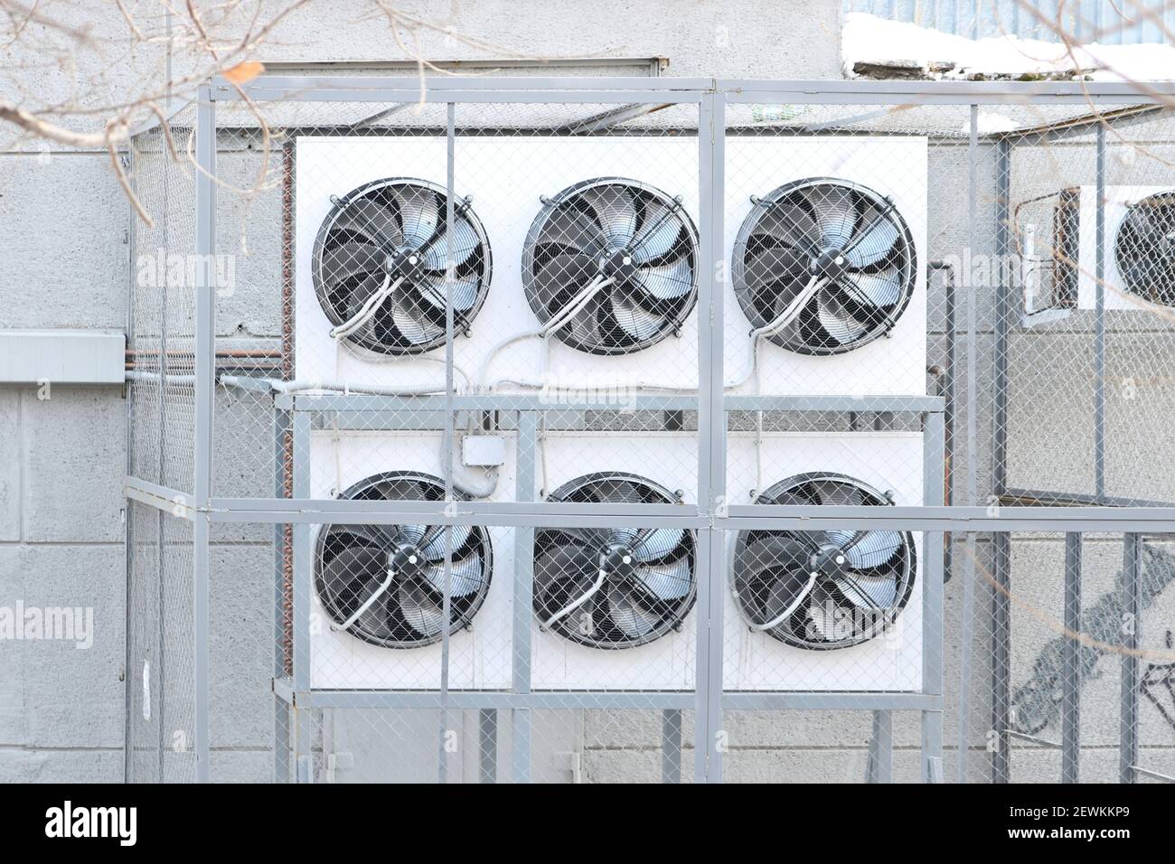Condenser side of a ductless split-type air conditioner. Air conditioning condenser units outside a building. Stock Photo