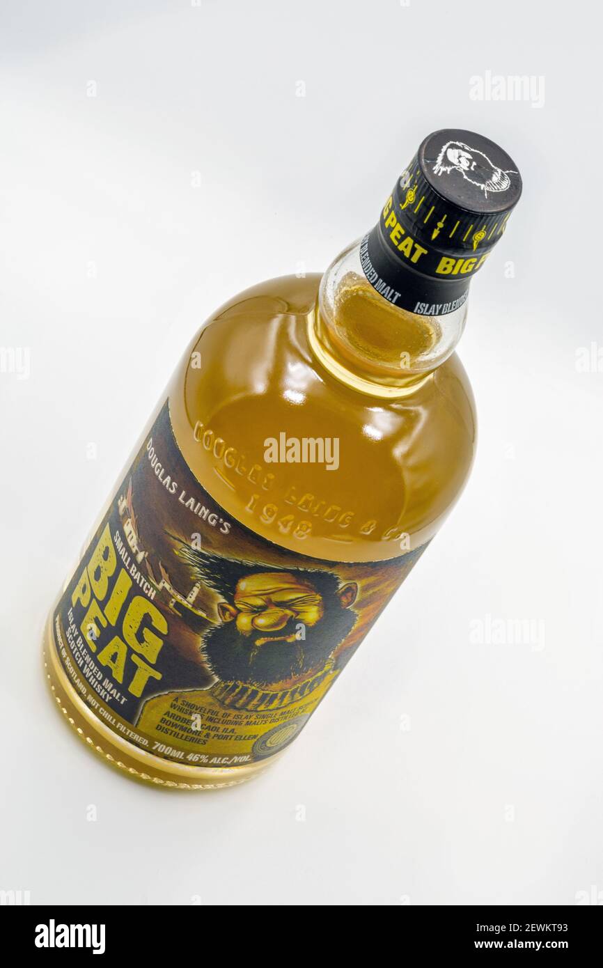 KYIV, UKRAINE - DECEMBER 17, 2020: Studio shoot of Small Batch Douglas Laing Big Peat Islay Blended Malt Scotch Whisky bottle closeup against white. Stock Photo