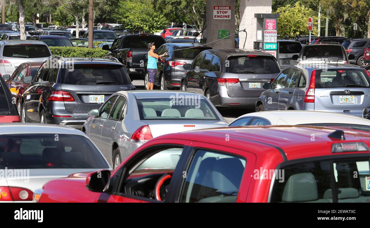 Patrons wait in line for gas at the Costco store on Wednesday, Oct. 5