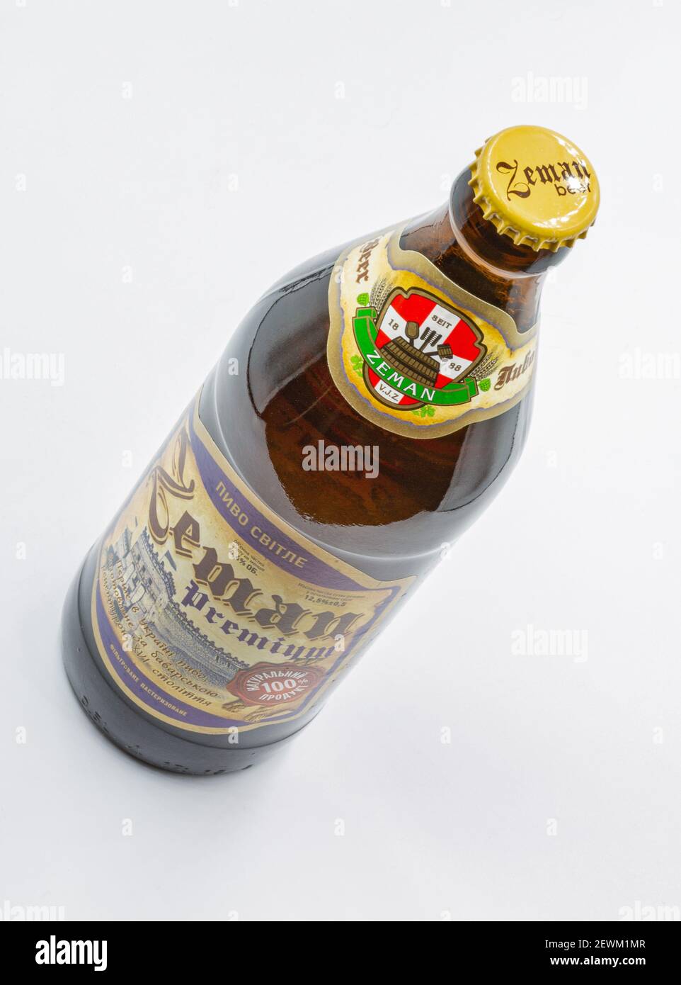 KYIV, UKRAINE - JANUARY 06, 2021: Studio shot of Ukrainian Zeman premium lager beer bottle closeup against white background. Lutsk castle on the label Stock Photo