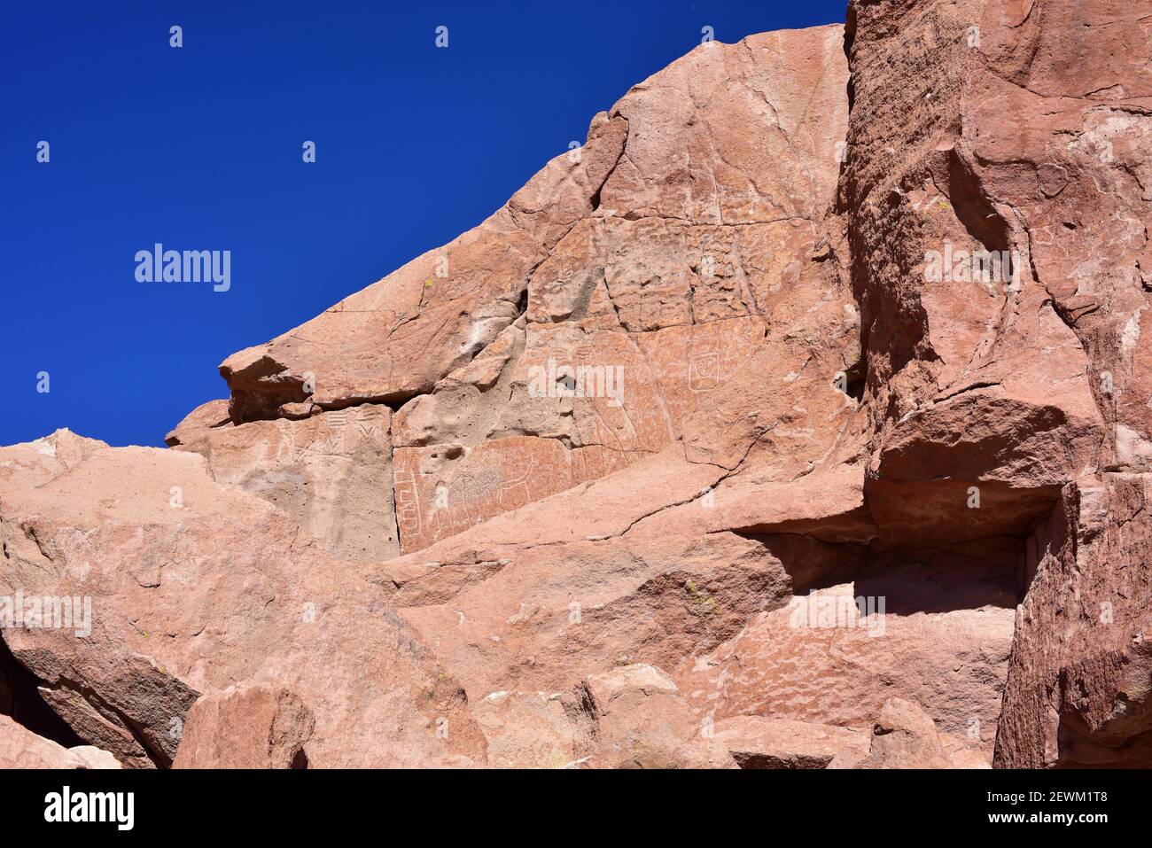 Petroglyphs in Estancia de Yerbas Buenas on rhyolite (volcanic rock). Santiago de Rio Grande, San Pedro de Atacama, Antofagasta, Chile. Stock Photo