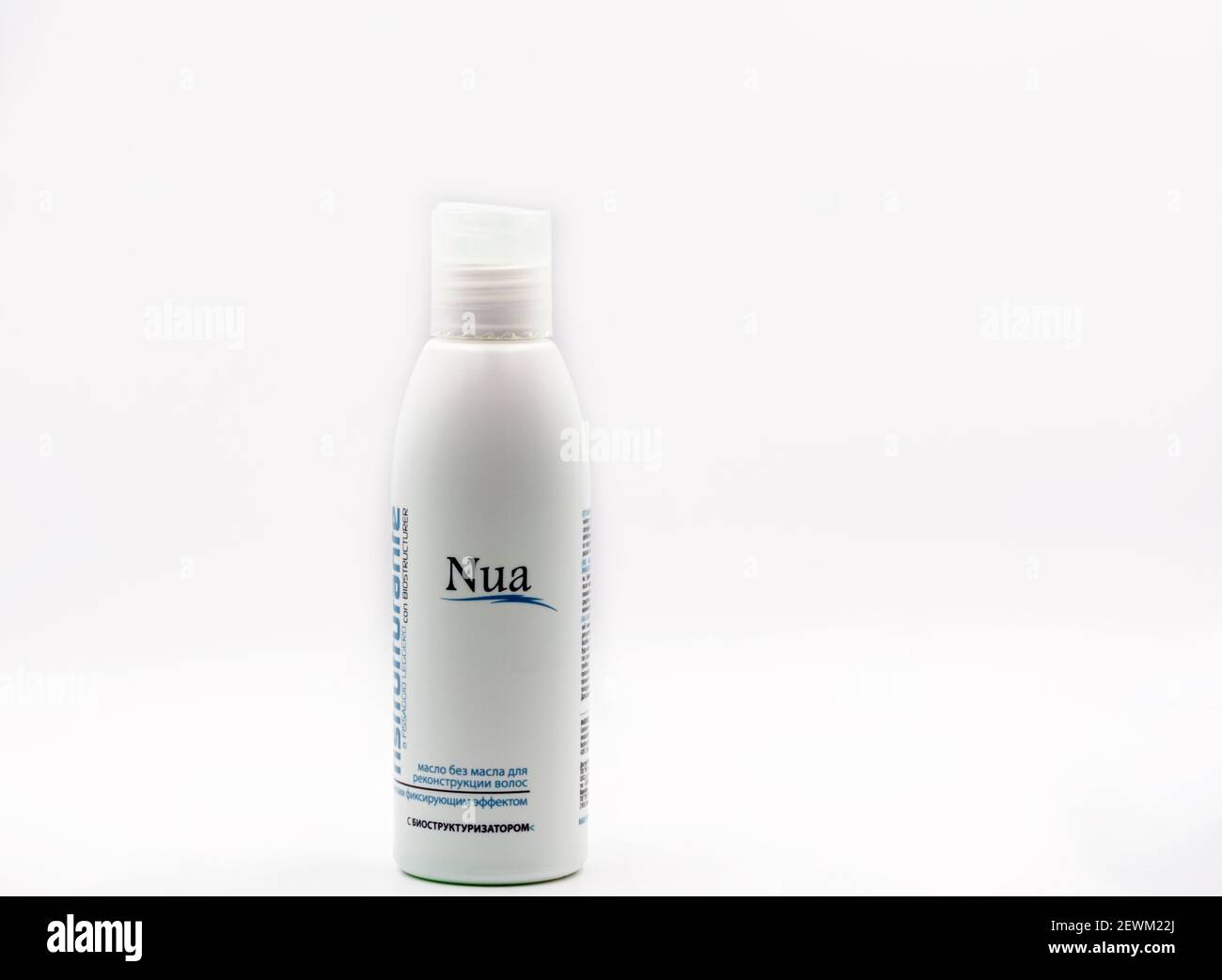 KYIV, UKRAINE - FEBRUARY 07, 2021: Studio shot of Italian professional hair care cosmetics Nua no oil ristrutturante shampoo bottle closeup against wh Stock Photo