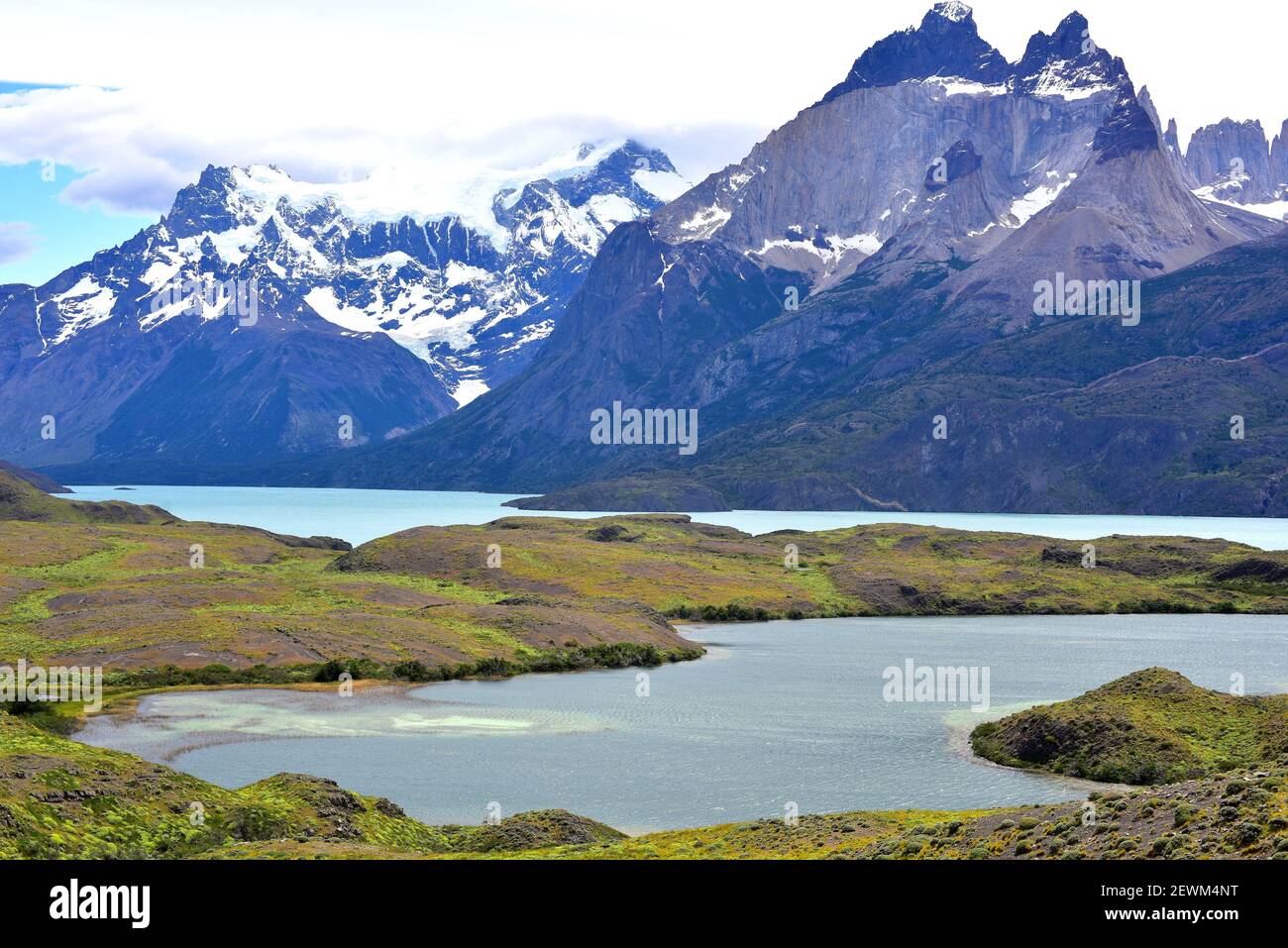 Torres del Paine National Park from Laguna Larga and Lago Nordenskjold. This mountain is a laccolith, light rock is granite and dark rock is a Stock Photo