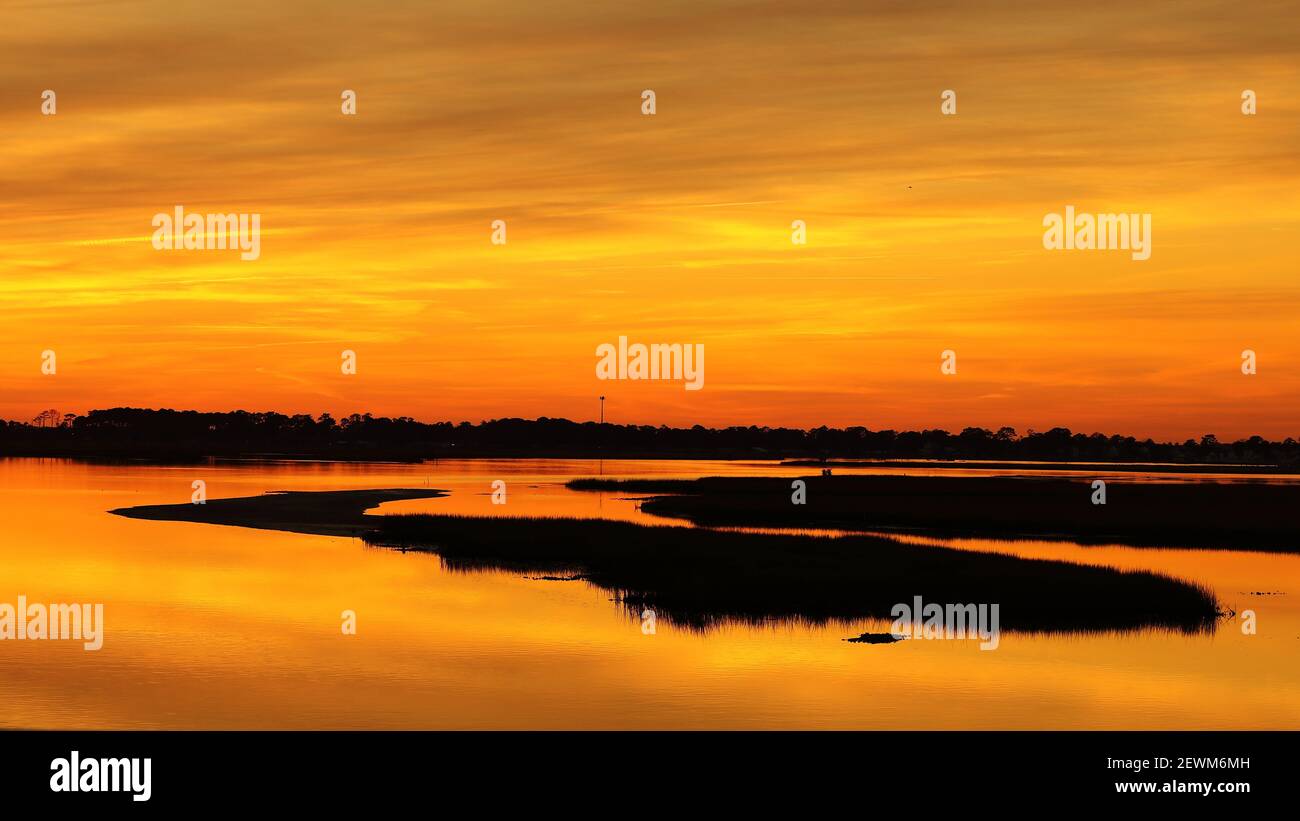 The landscape of an orange sunset on Delaware Islands in the United