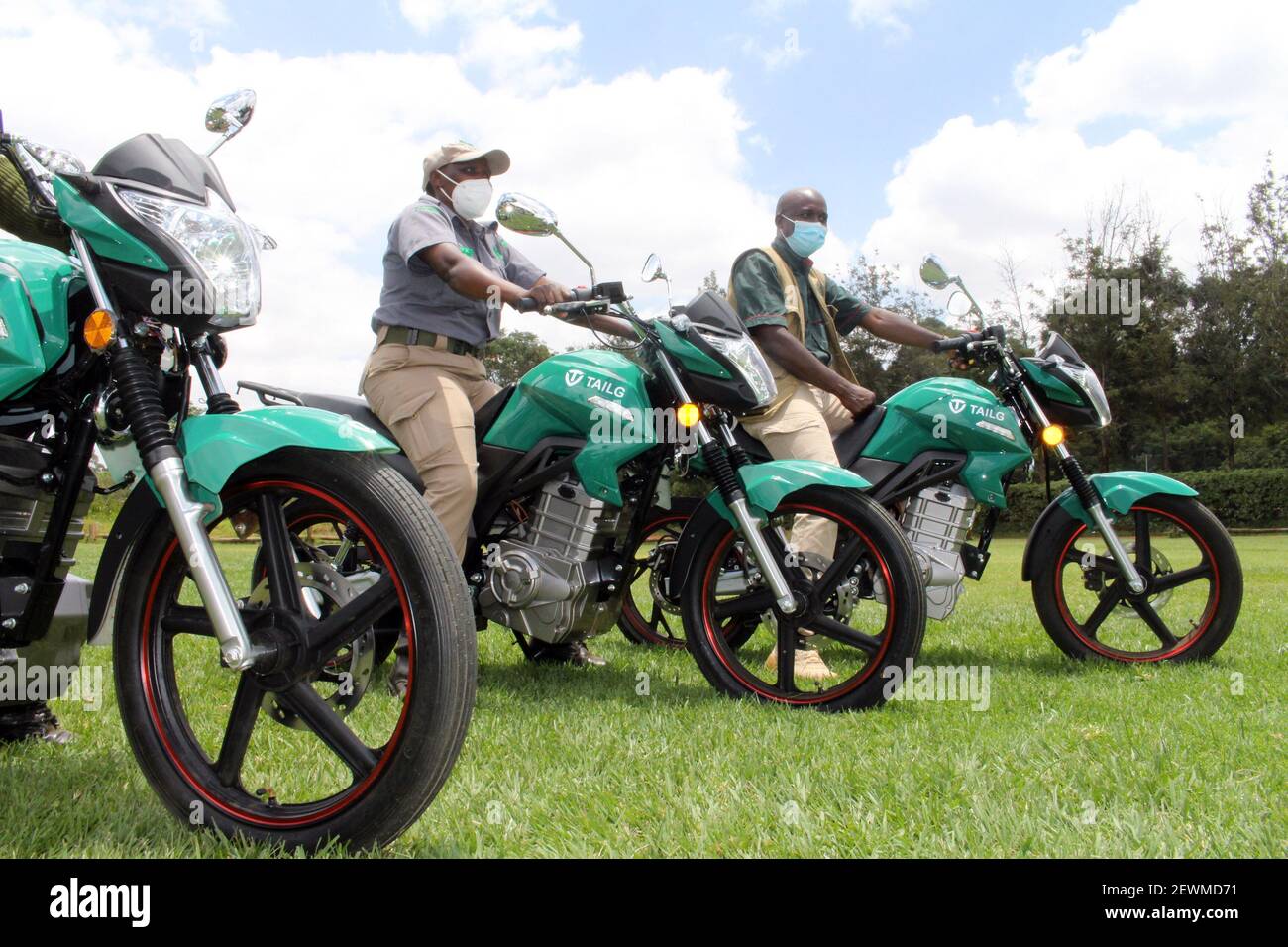Nairobi, Kenya, March 3, 2021Rangers test electric motorbikes in Nairobi, capital of Kenya, on March 2, 2021. The UN Environment Programme (UNEP) on Tuesday launched a pilot electric bikes project in Kenya's capital, Nairobi, setting the ball rolling for Africa's shift to electric mobility. The project which saw 49 motorcycles from China's Tailing Technology Group made little noise but raised much interest in Nairobi's Karura Forest aims to help policymakers assess the barriers in uptake of the much-needed technological shift towards electric bikes, and to demonstrate that Stock Photo