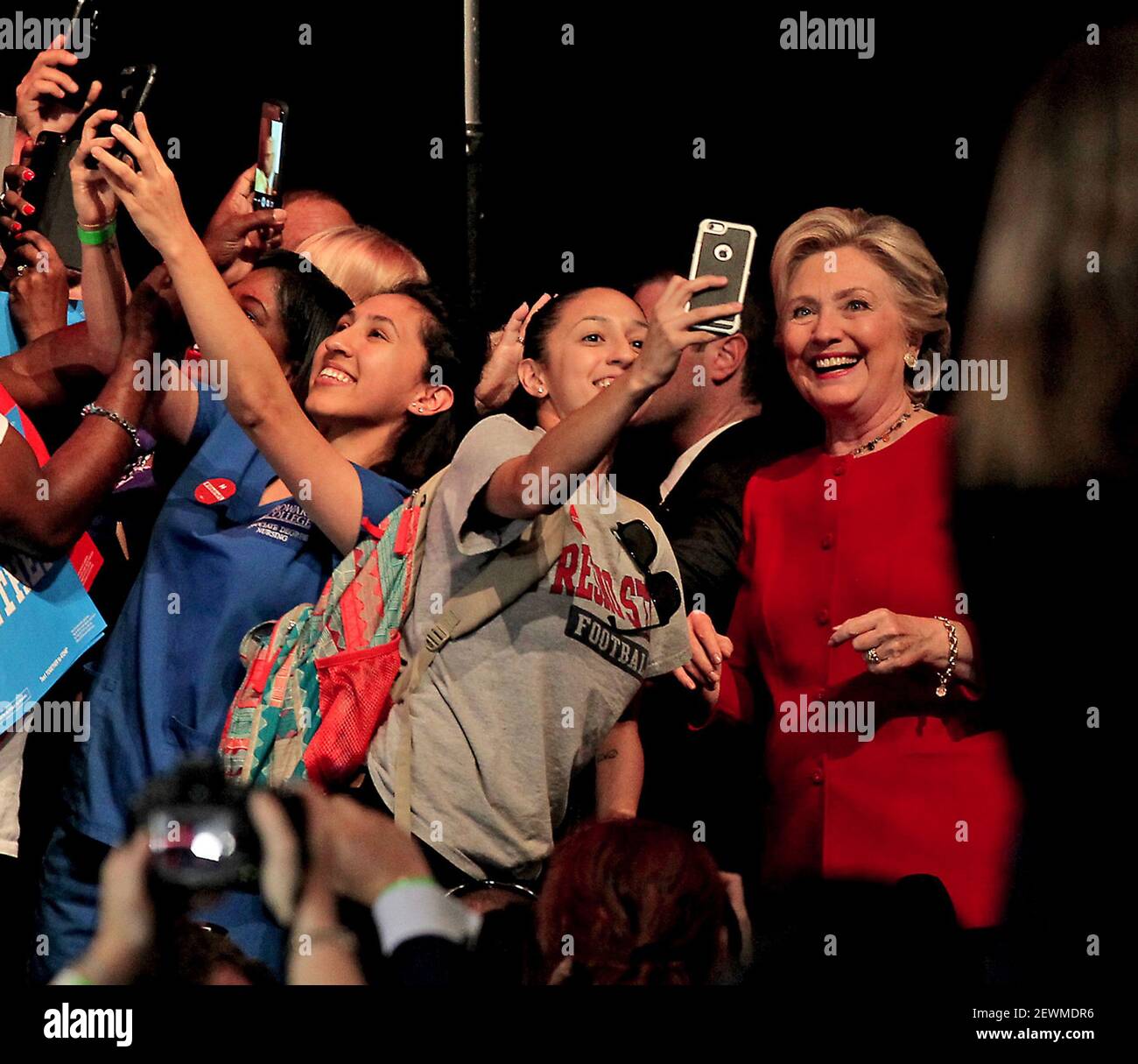 Democratic presidential nominee Hillary Clinton takes pictures with the ...