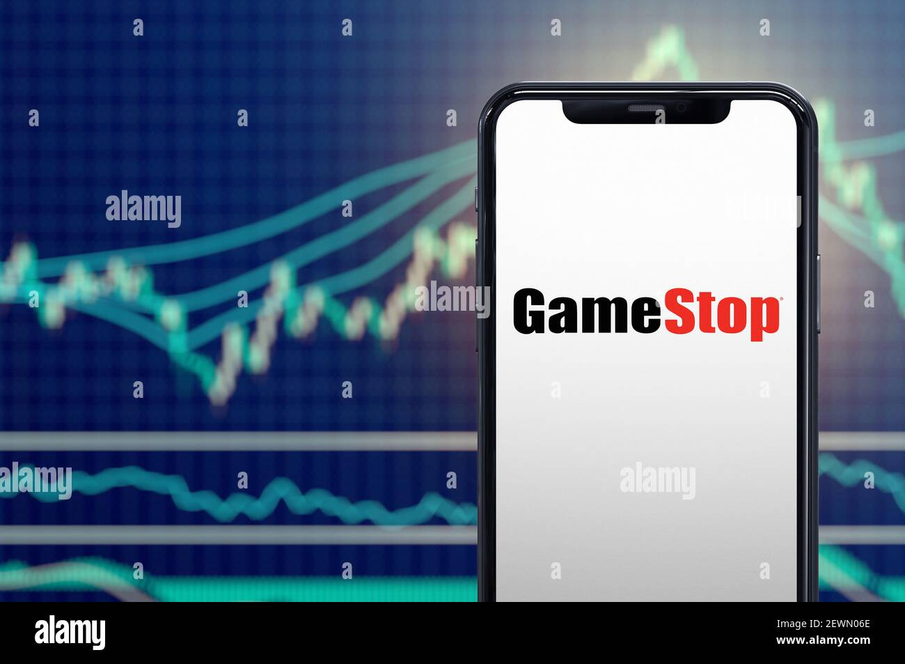 Milan, Italy: February 26, 2021: Gamestop retail company logo on the smartphone and its authentic stock price chart for the last 5 days. 3d rendering Stock Photo