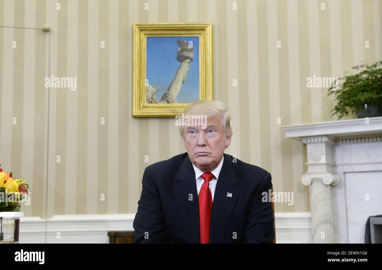 President-elect Donald Trump looks on in the Oval Office of the White ...