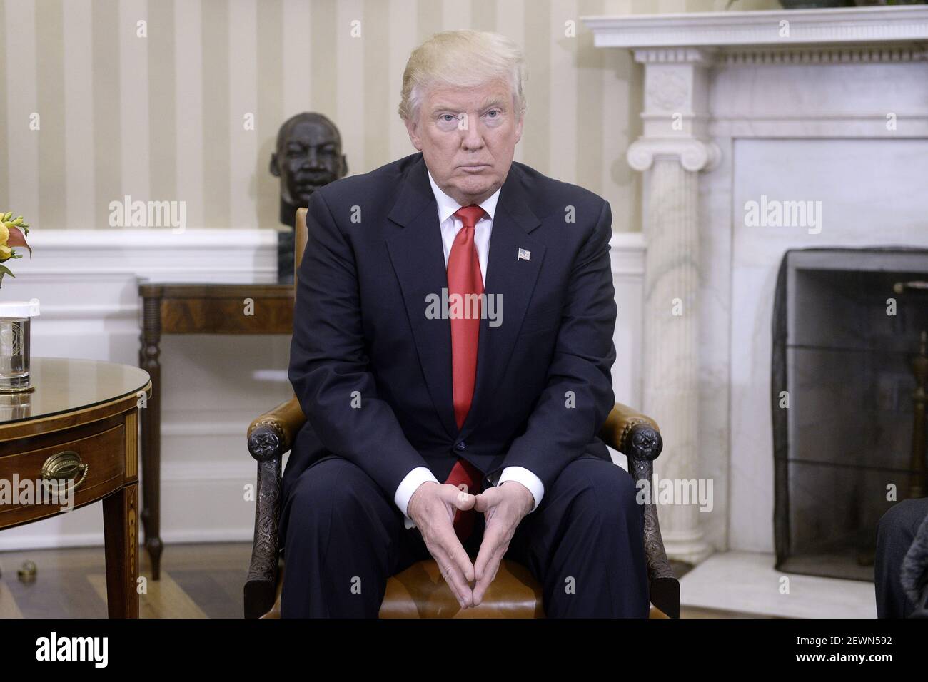 President-elect Donald Trump looks on in the Oval Office of the White ...