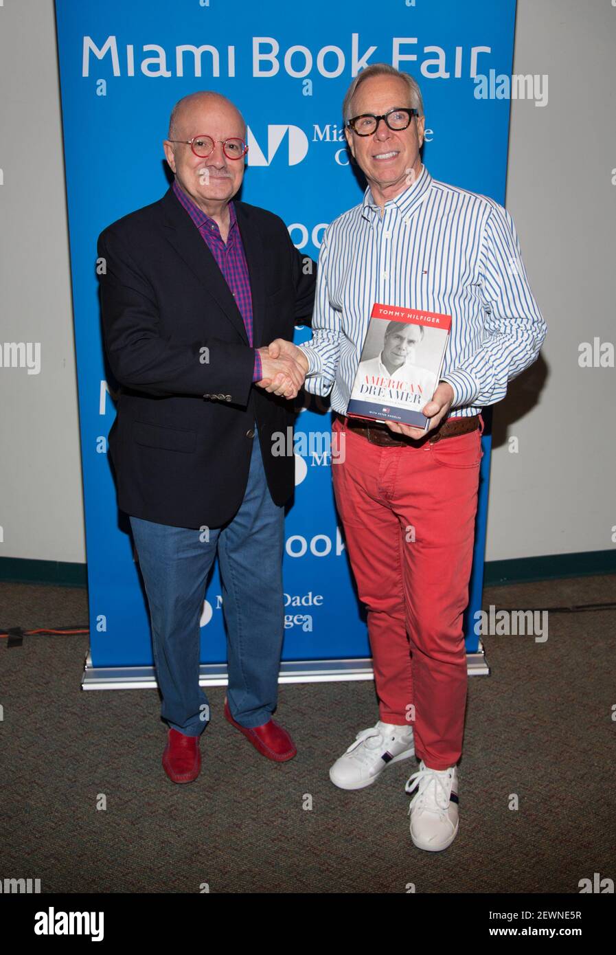 Dr. Eduardo J. Padron and Tommy Hilfiger are seen during Tommy Hilfiger  book presentation American Dreamer: My Live in Fashion & Business at the  Miami Book Fair on November 20, 2016 in