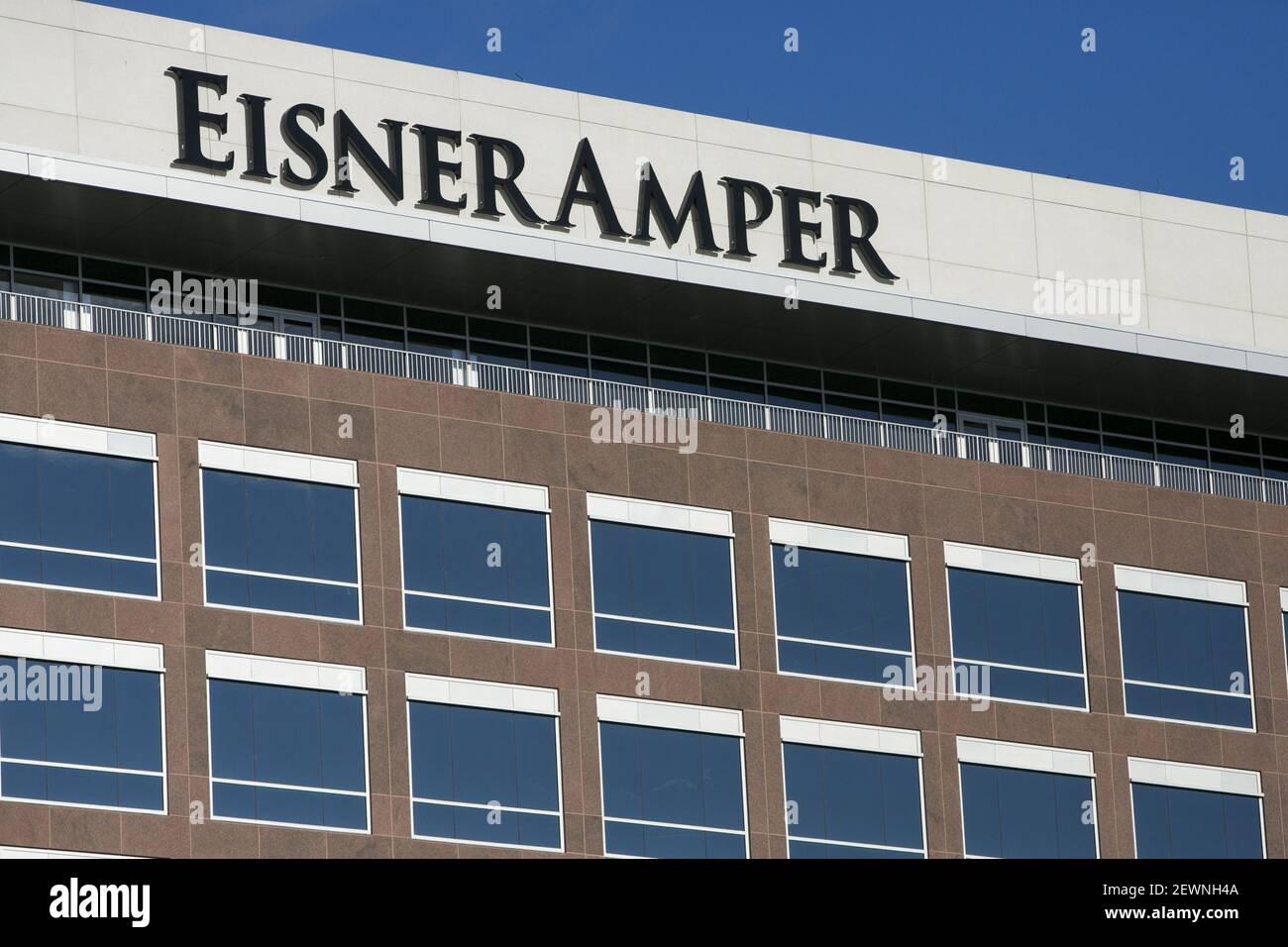 A logo sign outside of a facility occupied by EisnerAmper in Edison